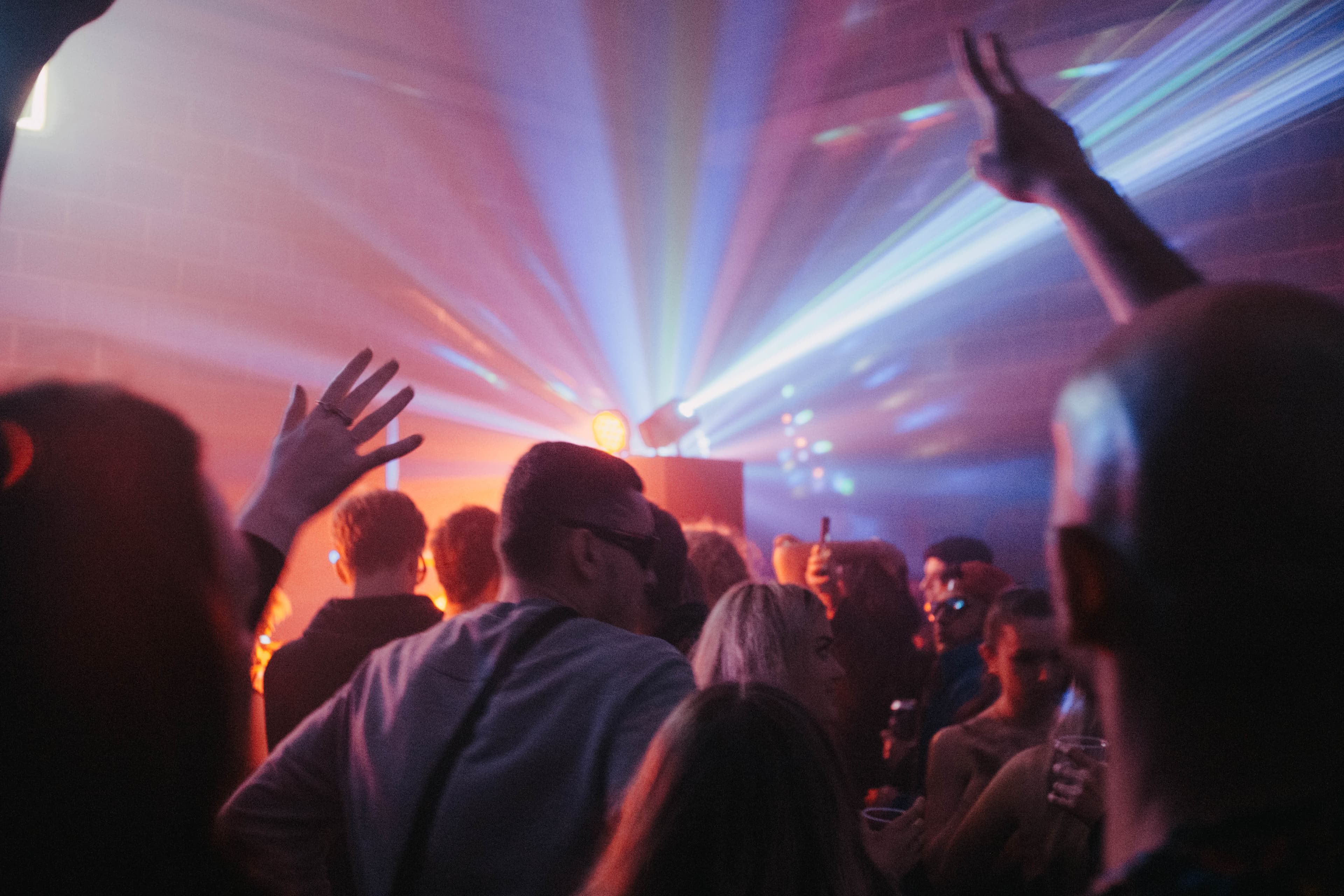 Crowd at music event with laser lights